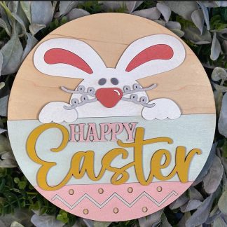 Painted version of wooden sign kit saying Happy Easter.