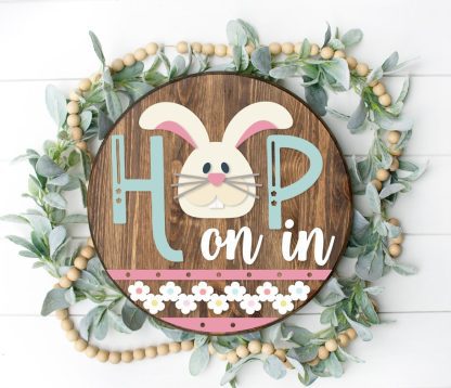 Painted version of wooden sign kit saying Hop on In.