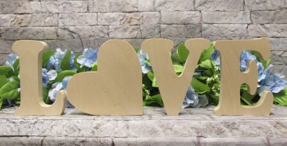 Free standing letters that spell LOVE with the O in the shape of a heart.