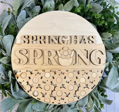 Painted version of wooden sign kit saying Spring has Sprung.